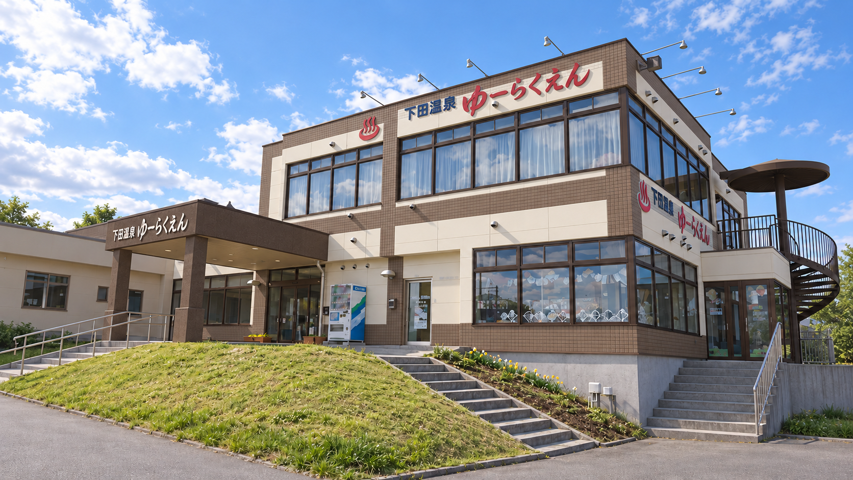 外壁をモカブラウン、壁面パネルをアイボリー、玄関の庇を濃い茶色に塗り替えた昼間の外観案